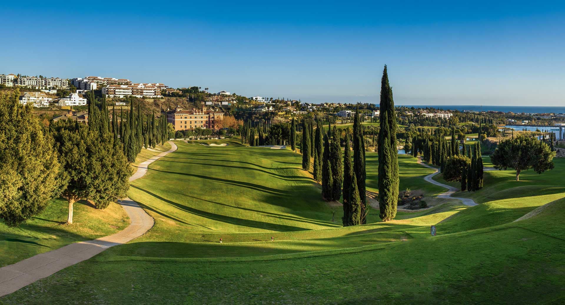 Villa Padierna golf course with cypress trees and sea view